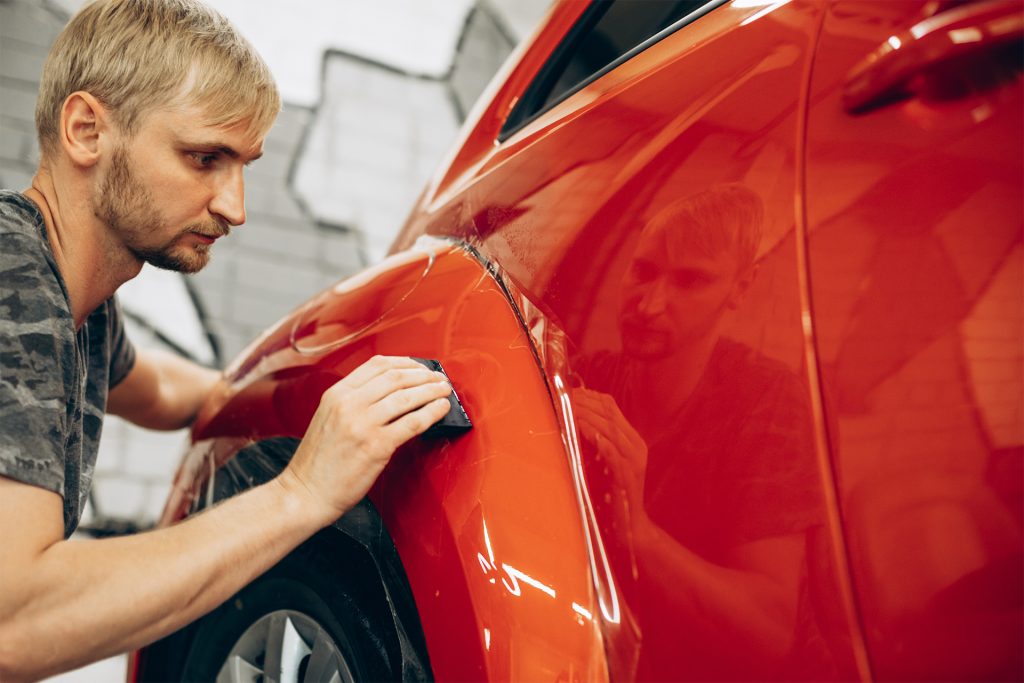 Car wrapping with foil at car service
